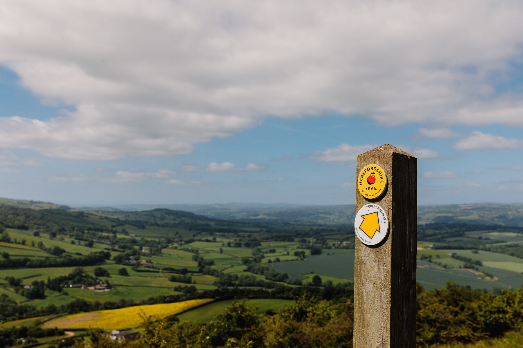 View of merbach hill with fingerpost for the Herefordshire Trail int he foreground.